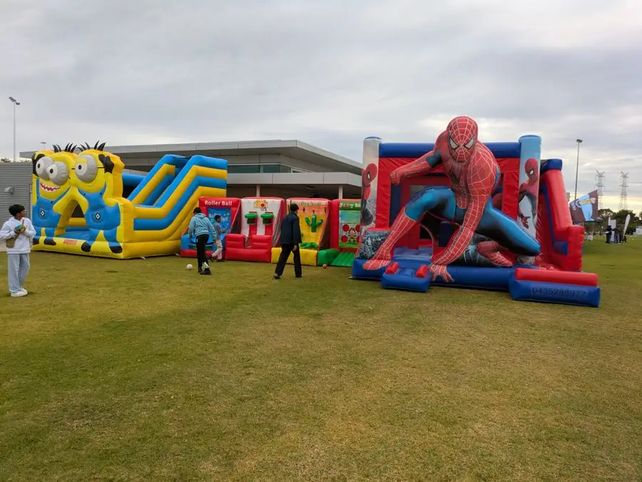Spider-Man, Minions and the carnival games set up together for a community event — Perth, WA