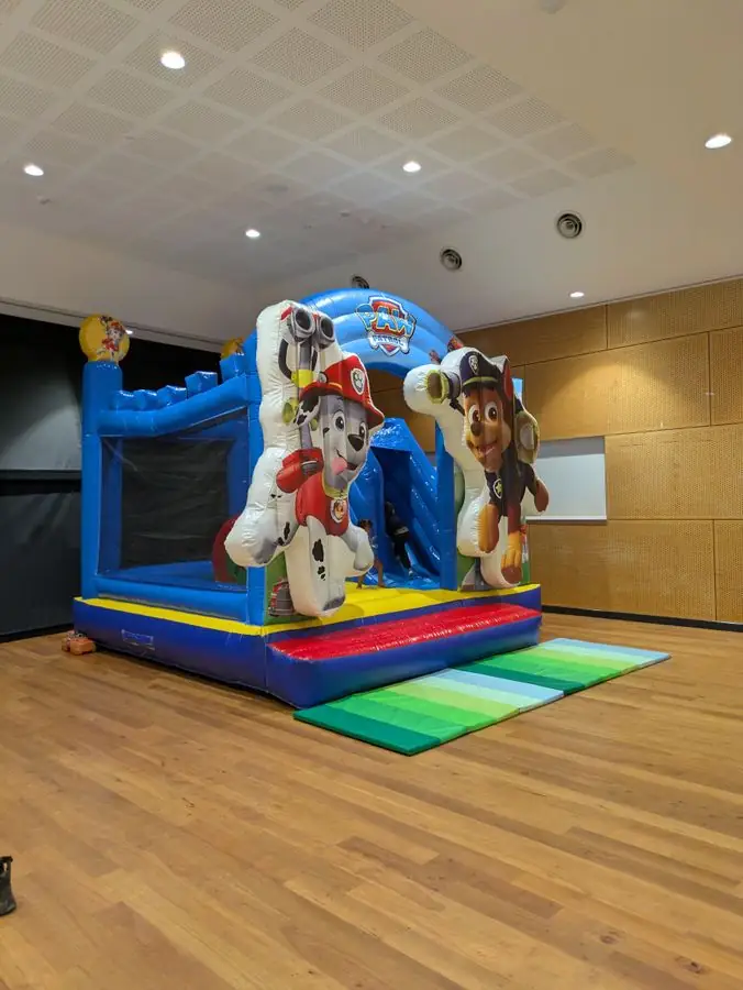 Paw Patrol combo castle on a hall floor with the safety mat in place — Perth, WA